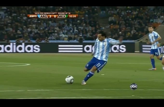 Broadcast frame, Argentina v Mexico, 2010 World Cup: Tevez plants beside the ball as he strikes