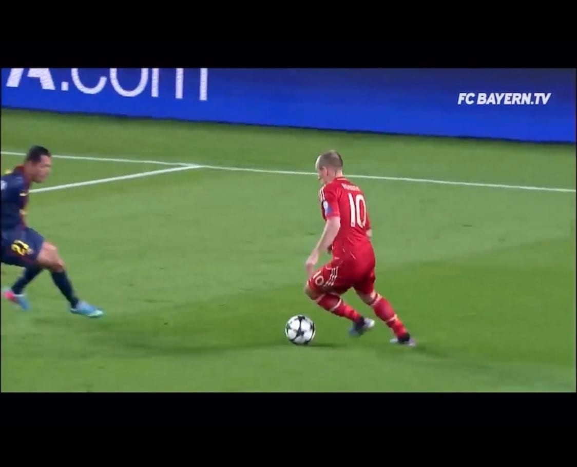 Frame: Robben shifts the ball onto his left foot as a Barcelona defender closes