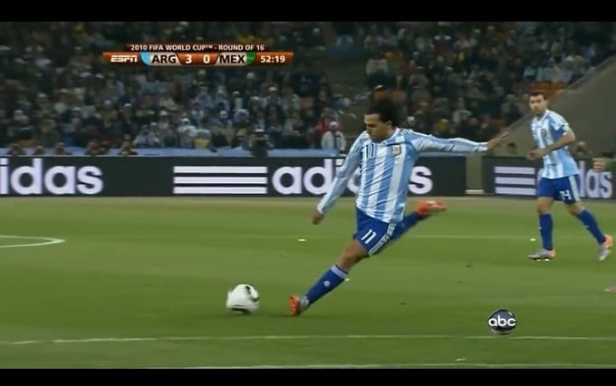 Broadcast frame, Argentina v Mexico, 2010 World Cup: Carlos Tevez winds up a shot, his opposite arm swinging across his body