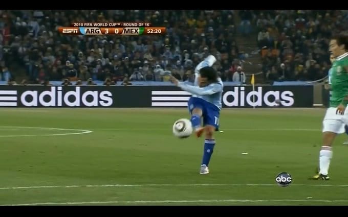 Broadcast frame, Argentina v Mexico, 2010 World Cup: Tevez follows through after striking the ball