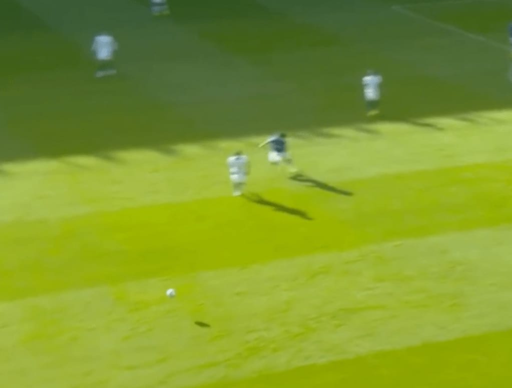 Broadcast frame, Everton v Chelsea: Iwobi's feint leaves Kanté short, with the ball rolling into the space behind