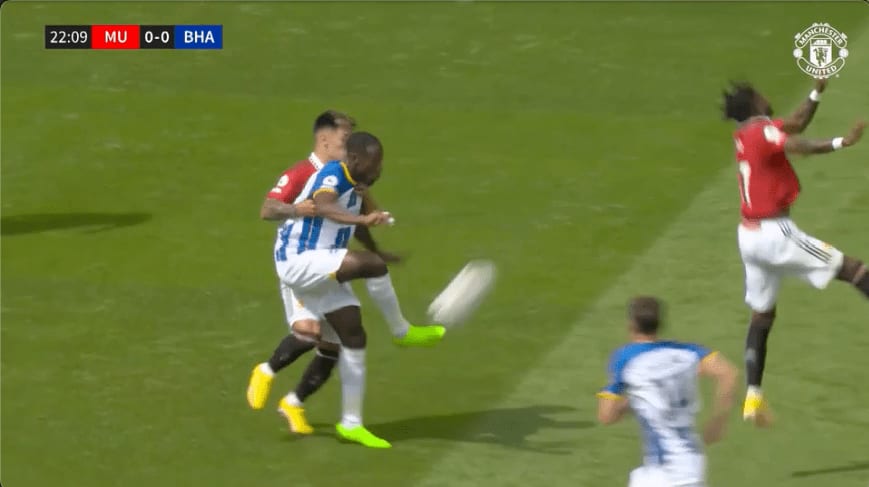 Broadcast frame, Manchester United v Brighton: Welbeck and Lisandro Martínez contest a header while Fred misses the challenge